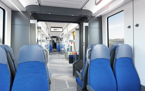Die Innenansicht des TramTrains, welche blaue Sitzgelegenheiten in der Bahn zeigt